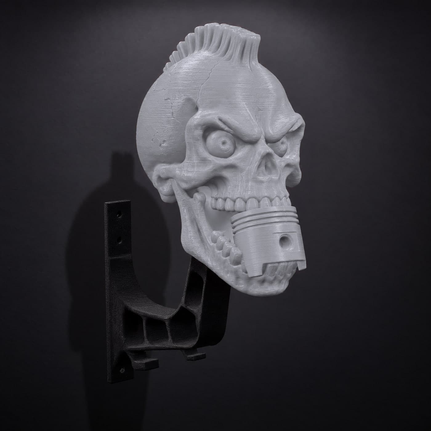 A Ghost Grey piston skull mount on the wall, three-quarter view