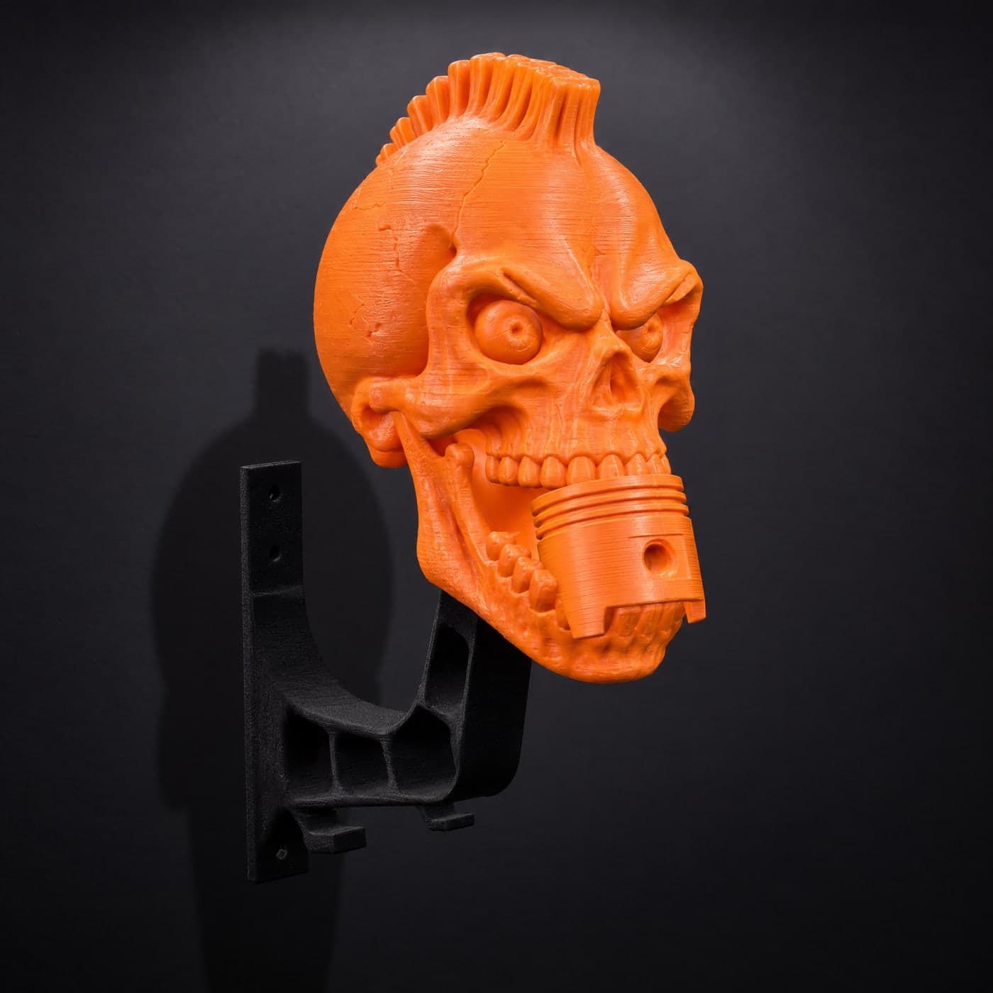 Blaze Orange — Piston skull mount on the wall, three-quarter view